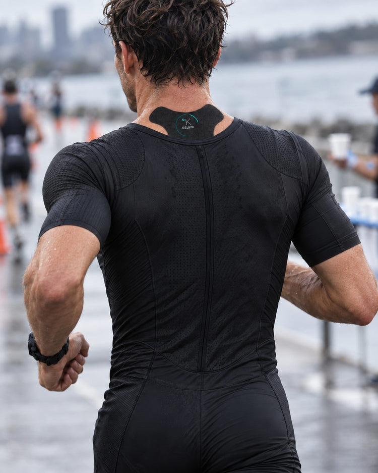 Triathlete with a KELVIN neck cooling patch on the back of the neck during the run leg of a race
